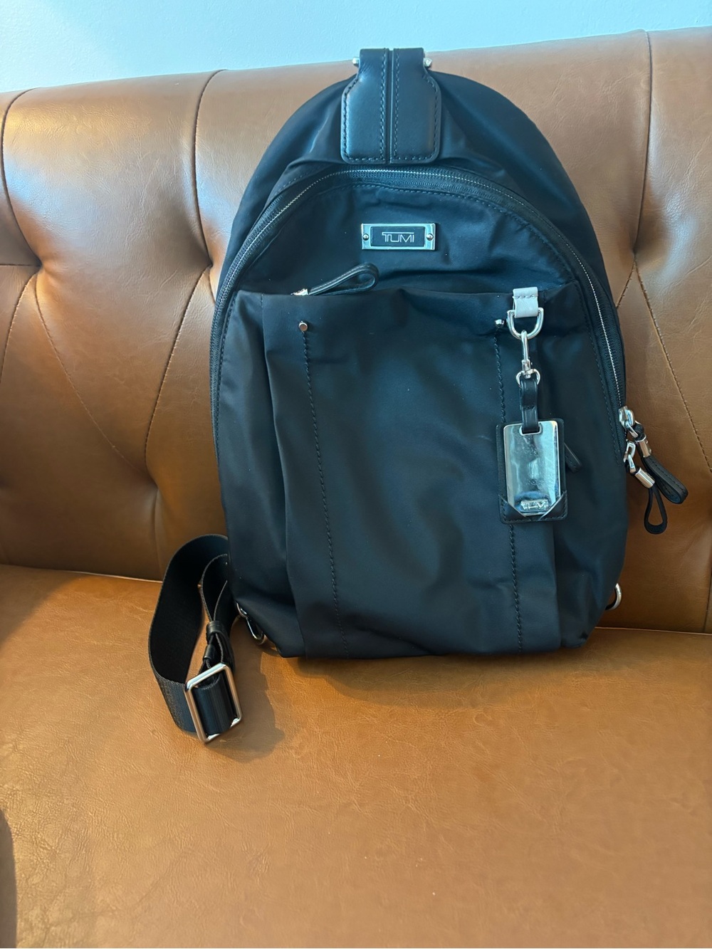 Tumi Black Men's Sling Backpack with Silver Hardware